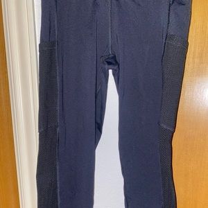 Black Aerie leggings with see through pattern on both sides of the legs